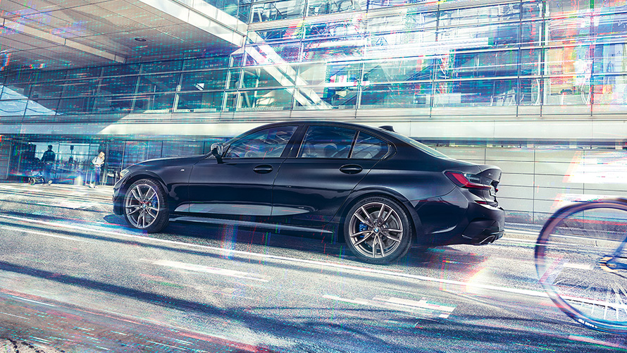 BMW M340i xDrive Sedán G20 2020 Black Sapphire metalizado Vista lateral, en marcha